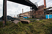 Huge, heavy steel production plant and industry terrain, producing various kinds of steel inside an CO2 Emitting and Exhausting Factory. IJmuiden, Netherlands.