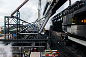 Huge, heavy steel production plant and industry terrain, producing various kinds of steel inside an CO2 Emitting and Exhausting Factory. IJmuiden, Netherlands.