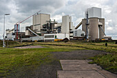 Huge, heavy steel production plant and industry terrain, producing various kinds of steel inside an CO2 Emitting and Exhausting Factory. IJmuiden, Netherlands.