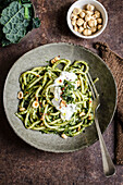 Pasta with kale and hazelnut pesto served with burrata