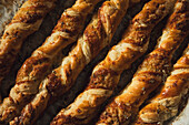 Homemade cheese straws on parchment paper