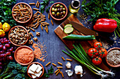 Plant-based whole food diet raw ingredients including fruit, vegetables, grains, legumes, tofu and nuts.