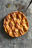 Homemade apple pie on a grey metal background