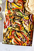 Portobello mushroom and bell pepper fajitas with avocado and tortillas