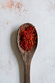 Saffron threads on a wooden spoon