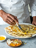 Peshwari naan, brushed with melted butter and sprinkled with apricot, pistachio and coconut.