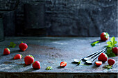 Fresh strawberries on a grey metal background