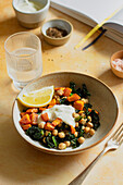 Cavolo nero and chickpea salad on a yellow background