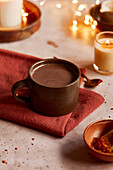 Hot Chocolate on a Red Napkin with Candles and spoon