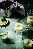 various individual lime possets on green backdrop