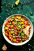 Pico de gallo made with heirloom tomatoes, served with chips