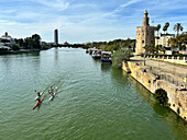 View of the Guadalquivir River with the Torre del Oro (Tower of Gold), a dodecagonal military watchtower erected by the Almohad Caliphate, Seville, Andalusia, Spain, Euroope