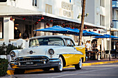 Oldsmobile Super 88 convertible parked in front of the Avalon Hotel, Ocean Drive, South Beach, Miami, Dade County, Florida, United States of America, North America