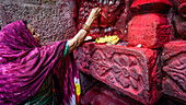 Female devotee with coin offering, Kamakhya Temple, Guwahati, Assam, India, Asia