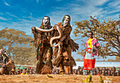 Masked dancers with snake, The Kulamba Traditional Ceremony of the Chewa people from Zambia, Mozambique and Malawi, held annually on the last Saturday in August to pay homage to their Chief Kalonga Gaia Uni, held near Katete, Eastern Province, Zambia, Africa