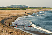 Kayakers in a bay La Grosse Ile, Magdalen Islands, Gulf of Saint Lawrence, Quebec province, Canada, North America