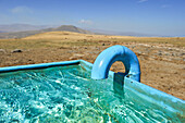 Watering place on the Argitchi plateau, Armaghan volcano in the background, Gegharkunik region, Armenia, Eurasia