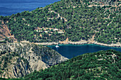 Rural landscape with moored yacht in a safe harbor surrounded by green vegetation, Kefalonia, Ionian Islands, Greek Islands, Greece, Europe