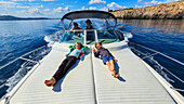 Young kids on a motorboat, Mallorca, Balearic islands, Spain, Mediterranean, Europe