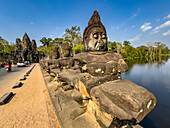 The bridge to Angkor Thom, lined on both sides with figurines ending in a corbelled arch entryway, Angkor, UNESCO World Heritage Site, Cambodia, Indochina, Southeast Asia, Asia