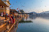 Pilgrims at Pushkar Lake at sunrise, Pushkar, Rajasthan, India, South Asia, Asia