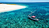 Aerial of a traditional Dhow on a white sand beach, Goa island near the Island of Mozambique, Mozambique, Africa