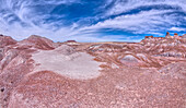 A small hill of gray bentonite clay that appears to be melting into the purple bentonite of Hamilili Valley on the south end of Petrified Forest National Park, Arizona, United States of America, North America