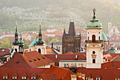 Old Town Bridge Tower and other spires against Petrin Hill, Old Town, UNESCO World Heritage Site, Prague, Czech Republic (Czechia), Europe