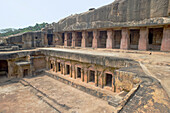 Monks' cells cut into the hillside rock among the Udayagiri and Khandagiri caves dating back to over 100 years BCE sculpted as religious retreats for Jain devotees, Bhubaneswar, Odisha, India, Asia