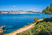 View of rocky shoreline by turquoise sea and Santa Ponsa, Majorca, Balearic Islands, Spain, Mediterranean, Europe