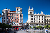 Modernist architecture from early 20th century in Plaza de las Tendillas, Cordoba, Spain. The square is a lively hub with historical buildings and local culture.