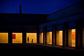 Stunning night view of the illuminated courtyard at the Centro de Arte Contemporáneo de Andalucía, Monasterio de la Cartuja, in Seville, Spain.