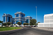 Modern office buildings in Sevilla's Torneo Business Park, Andalucia, Spain. Clear blue sky highlighting the architectural design.