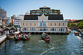 Boat ride through canals in a colorful and traditional Moliceiro boat, Aveiro, Portugal