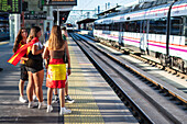 Spanish fans wait for the train to join street celebrations in Madrid after Euro 2024 champions Spain returned home to a royal welcome, Madrid