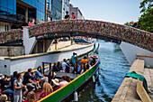 Boat ride through canals in a colorful and traditional Moliceiro boat, Aveiro, Portugal