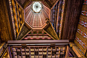 Interior of St. Joseph’s Church in Le Havre, showcasing Auguste Perret’s modernist design with vibrant stained glass.