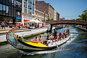 Boat ride through canals in a colorful and traditional Moliceiro boat, Aveiro, Portugal