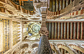 Close up view of the ornate ceiling and architectural details of the historic Cordoba Mosque in Andalusia, Spain.