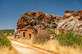 Abandoned mining installation at Cerro del Hierro in Sierra Norte Natural Park, Sevilla, Spain. Karstic landscape altered by historical iron mining activities.