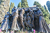 Bronze sculpture group by Mariano Benlliure at the tomb of bullfighter Joselito in Cementerio de San Fernando, Sevilla, Spain. Monumental artwork representing sorrow and homage.