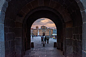 View of Plaza del Mercado Grande and San Pedro Apostol Church through the Alcazar Gate in Avila, Castilla y Leon, Spain.