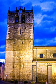 A view of the historic Nuestra Senora del Manto church, a 15th-century structure, located in Riaza, Segovia, Spain, captured at dusk.