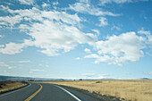 Highway 95 crossing grassy field