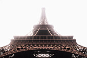 Low angle view of Eiffel Tower in mist