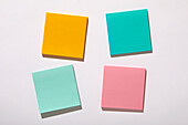 Colorful blank adhesive notes on white background