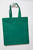 Green tote bag on white background