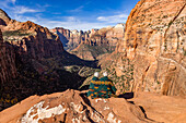 Rear view of couple wrapped in blanket looking at Zion Canyon from Zion Overlook