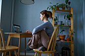 Woman using laptop at home