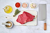 Raw beef steak with herbs and spices